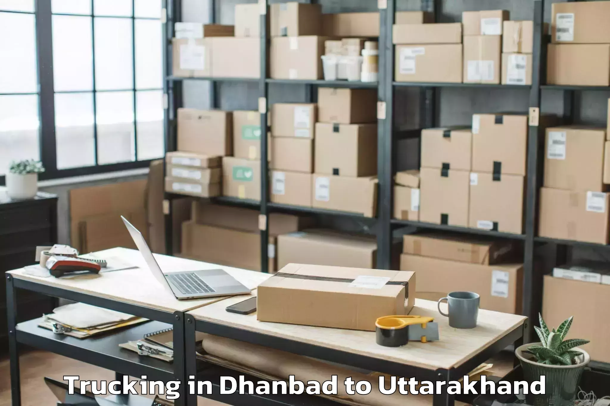 Dhanbad to Hemwati Nandan Bahuguna Uttara Trucking Booking